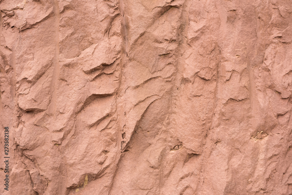 Reddish brown hard soil cracks stripes irregular texture background closeup
