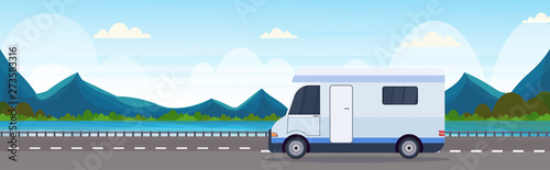 caravan car traveling on highway recreational travel vehicle camping concept beautiful nature river mountains landscape background flat horizontal © mast3r