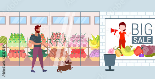 man walking with dog guy and his pet having fun in front of supermarket mall grocery shop exterior flat full length horizontal