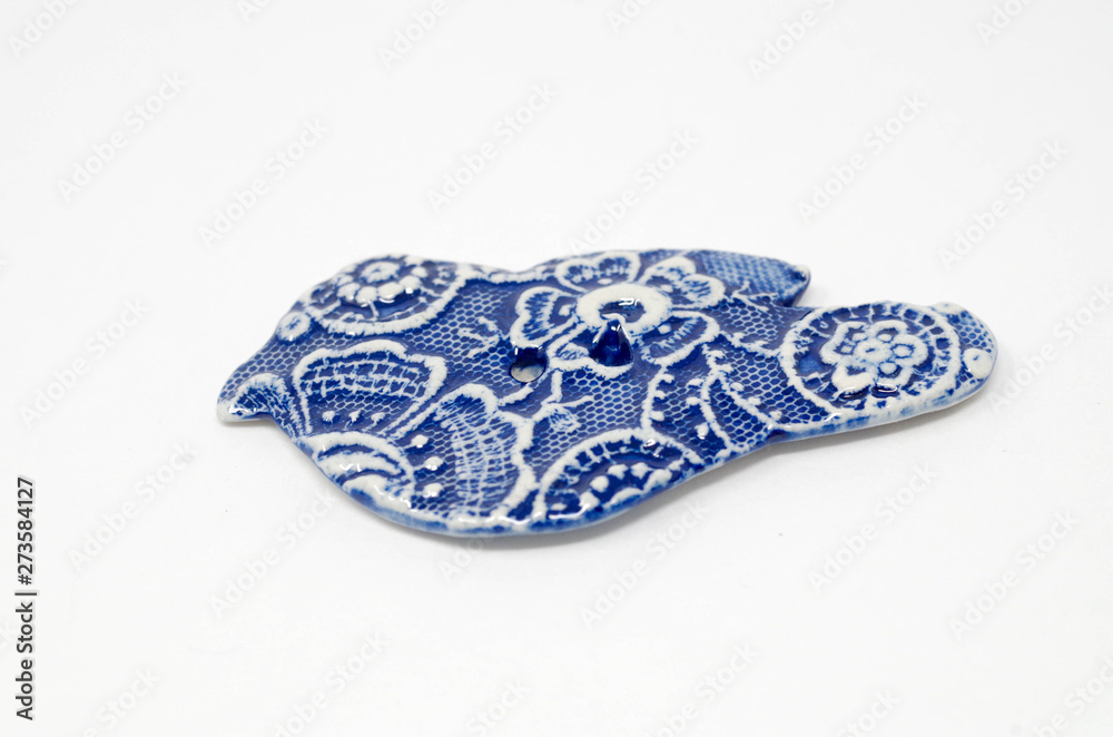 Fototapeta premium Bird shape ceramic button - Germany
