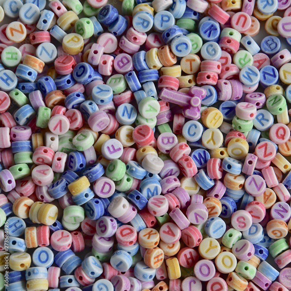 Fototapeta premium Pastel coloured alphabet beads.