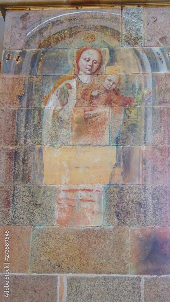 Faded fresco on cathedral wall