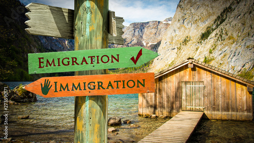 Street Sign Emigration versus Immigration