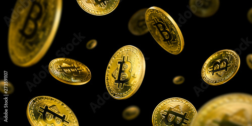 Gold Bitcoin coins flying on a black background photo