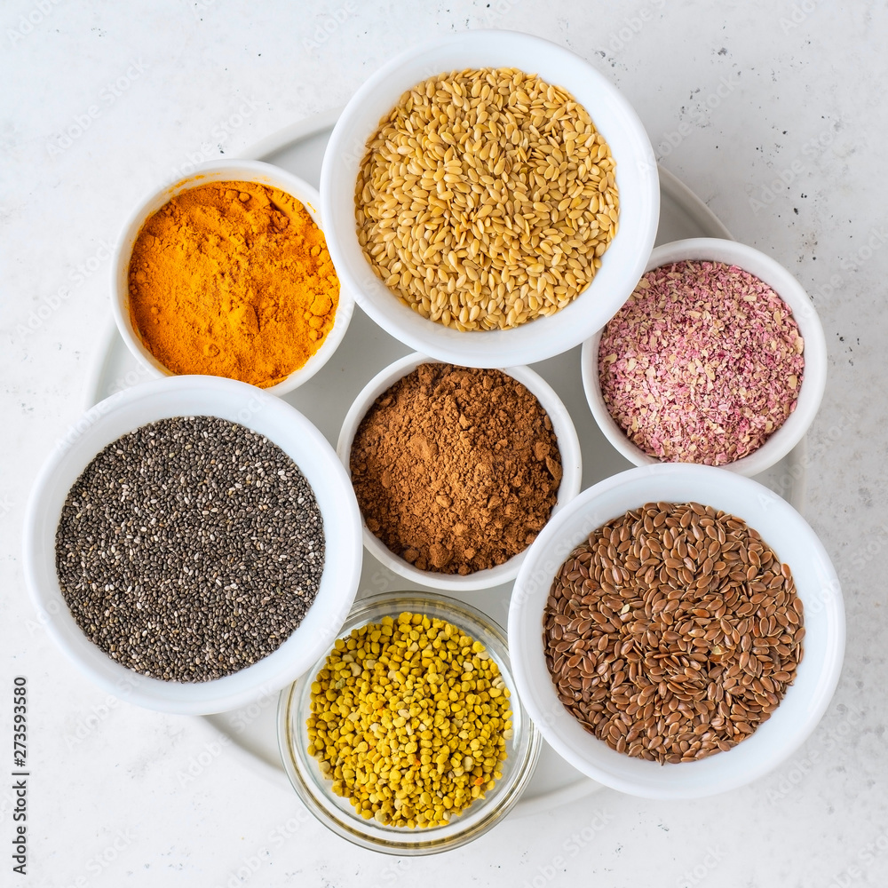 Healthy super food clean eating selection (seeds, powder turmeric, carob, bee pollen, dried beet) Healthy super food clean eating selection (seeds, powder turmeric, carob, bee pollen, dried beet)