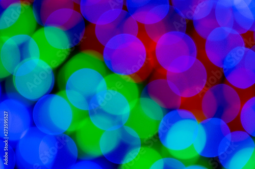 Blurry multicolored garland with glowing lights. Christmas, new year, birthday and wedding concept