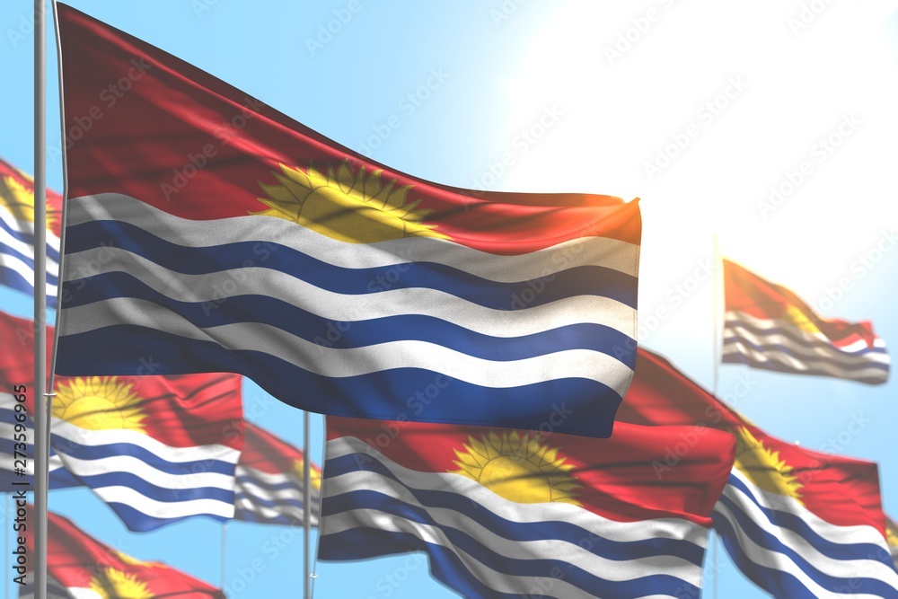 beautiful celebration flag 3d illustration. - many Kiribati flags are waving against blue sky image with bokeh