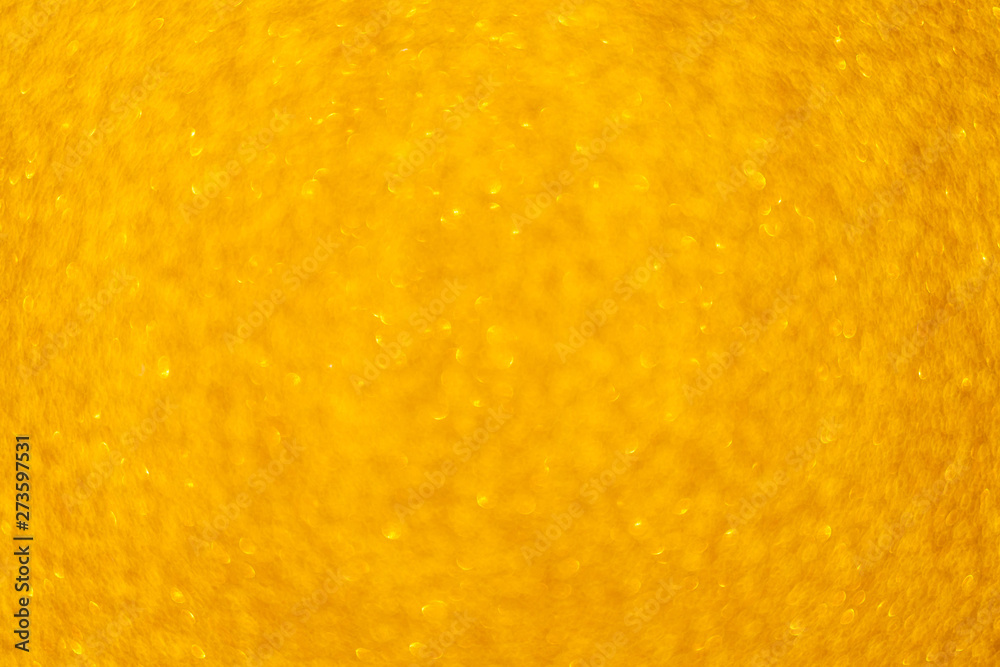 Blurred background - golden sparkles. Abstract image. Bright color. Abstract circular bokeh. Blurred background - golden sparkles. Abstract image. Bright color. Abstract circular bokeh.