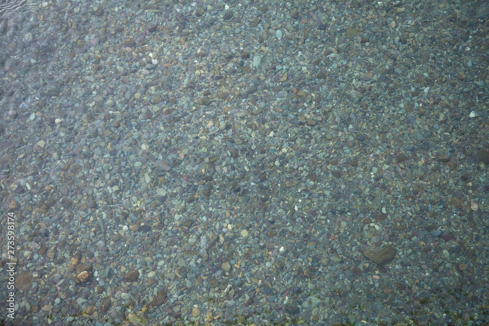 stones under the clear water stones under the clear water