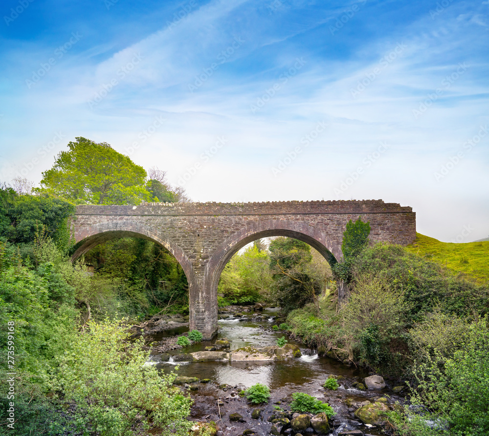 Double-arch rubble stone railway bridge over Finglas river