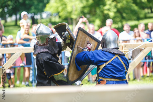 Canvastavla medieval jousting knight fight, in armor, helmets, chain mail with axes and swords on lists