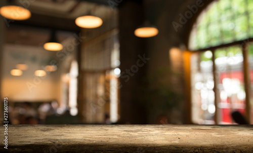 blurred background of bar and dark brown desk space of retro wood © kishivan