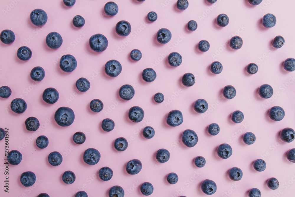 Pink surface with decorative blueberries Pink surface with decorative blueberries
