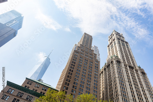 New York, Manhattan. High buildings view from below against blue sky background