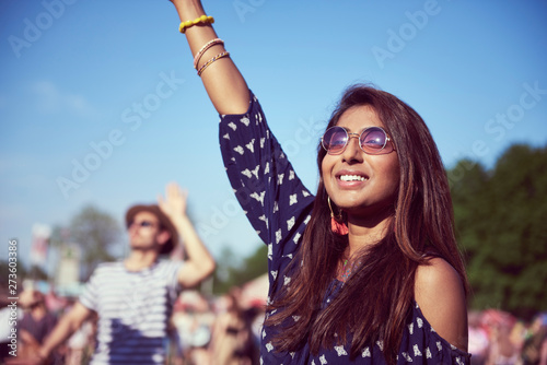 Beautiful Asian woman having great fun at music festival © gpointstudio