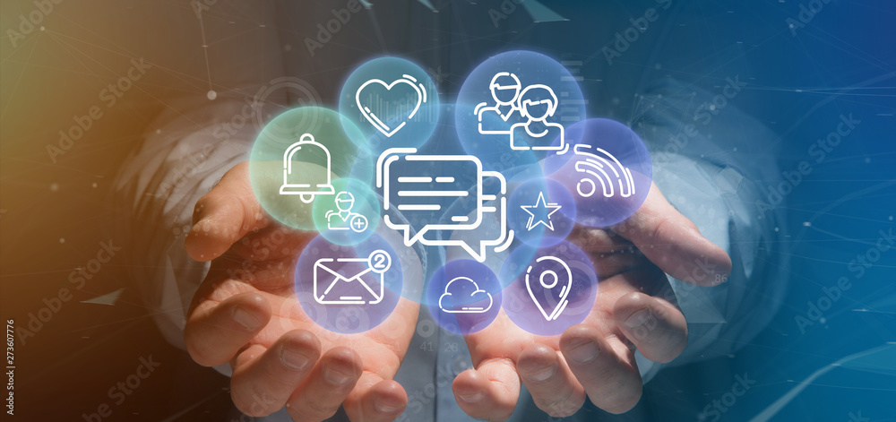 Fototapeta premium Businessman holding a cloud of social media network icon