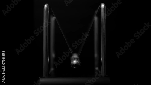 Newton's cradle in motion, five-ball system in one-ball movement, ball swinging towards the camera. Slow zoom in, black and white, slow motion, close up shot.