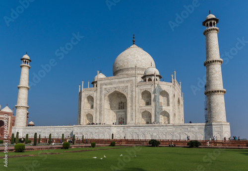 Agra, India - probably the most recognizable landmark of India, the Taj Mahal is an ivory-white marble mausoleum dedicated to the Emperess Mumtaz Mahal. Here in the picture it's unmistakable shape