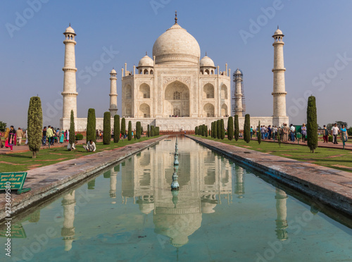 Agra, India - probably the most recognizable landmark of India, the Taj Mahal is an ivory-white marble mausoleum dedicated to the Emperess Mumtaz Mahal. Here in the picture it's unmistakable shape