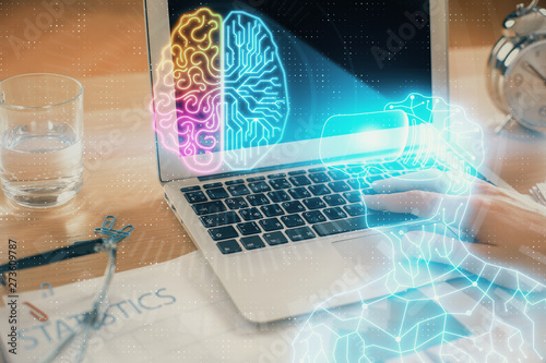 AR hologram with man working on computer on background. Augmented reality concept. Double exposure.