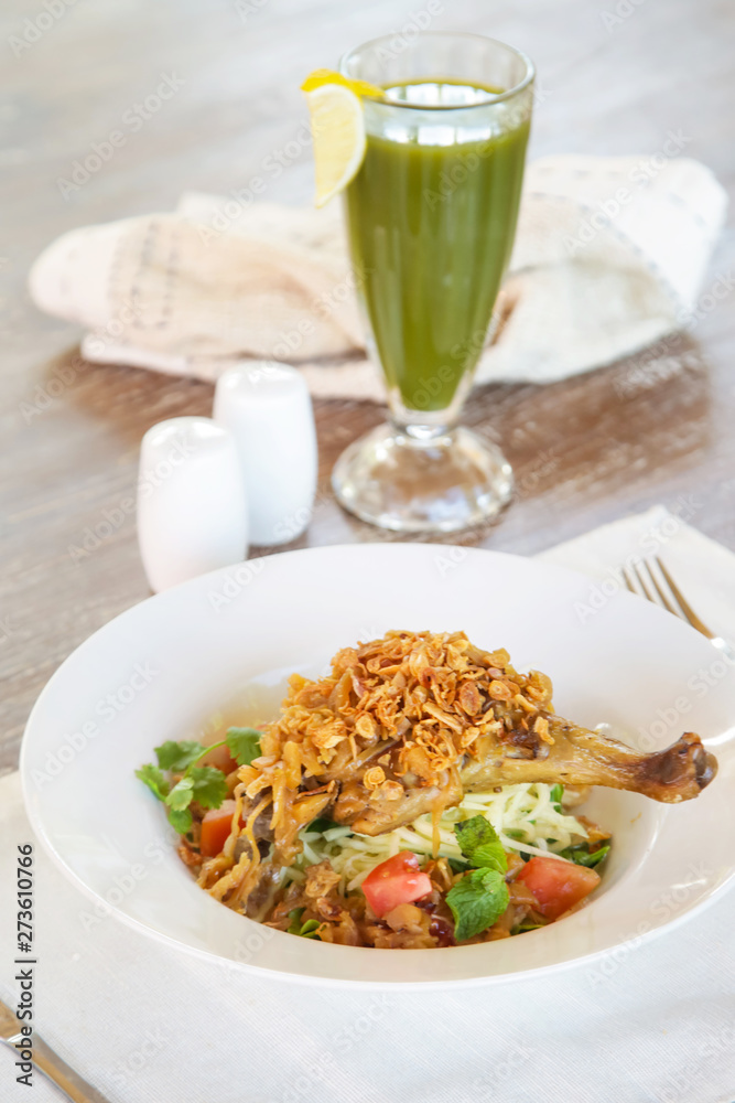 Crispy crunchy cornflakes chicken served with a veggie organic green smoothie, casual healthy dining concept