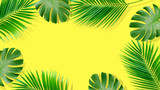 Summer composition. Tropical palm leaves on yellow background. Summer concept.