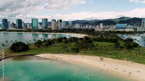Flying over the lagoon, park and beach of Ala Moana and Magic Island, Hawaii.