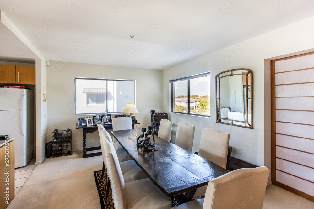 Fototapeta premium Dining Area with a Gothic Table and Large Windows