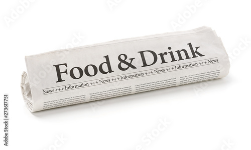 Rolled newspaper with the headline Food and Drink