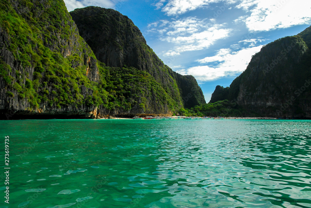 Rocky walls, with crystal clear waters near Maya bay, Ko Phi Phi island, Phuket, Thailand	
