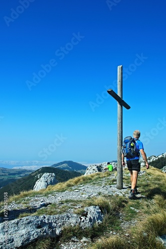 Croatia-view of tourist on the top Ljubicno Brdo in the Velebit National Park