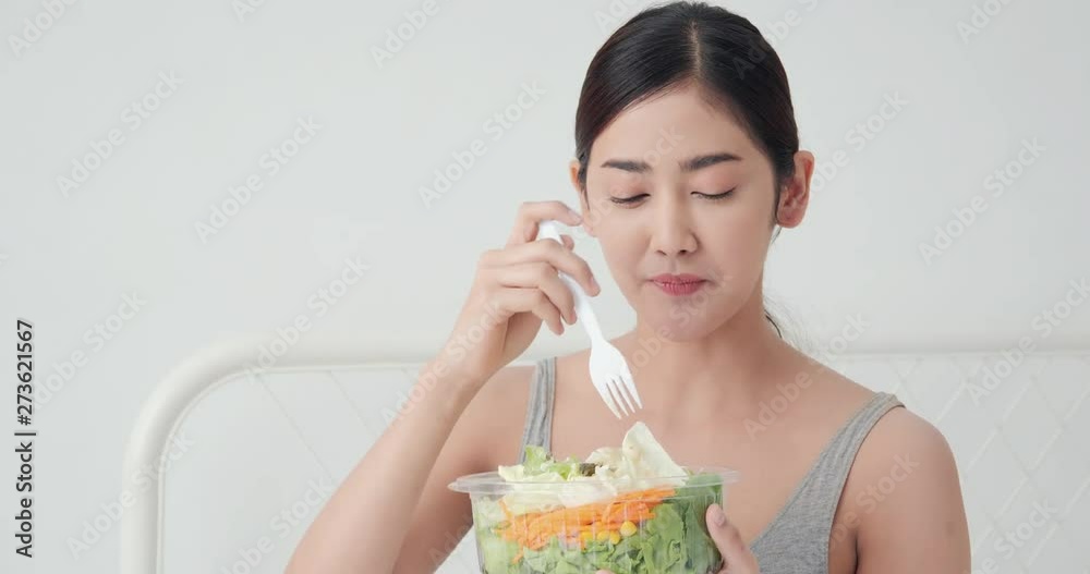 beauty woman eat salad with happy emotion at home. Healthy concept. beauty woman eat salad with happy emotion at home. Healthy concept.