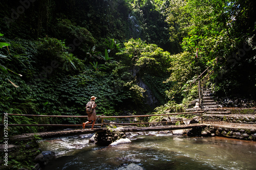 Woman near Nung Nung waterfal on Bali, Indonesia
