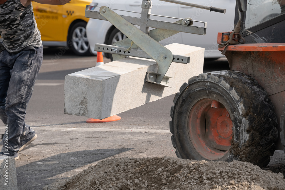 Installing pavement curb level and rubber hammers. Installing pavement curb level and rubber hammers.