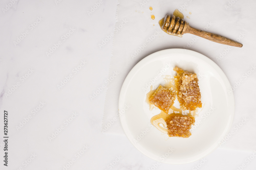 Fototapeta premium Top view honey with honeycomb pieces