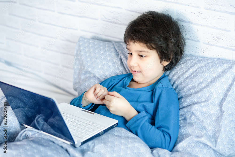 Concept of little businessman, webmaster, programmer, developer, Website designer. Little child and laptop, computer notebook Concept of little businessman, webmaster, programmer, developer, Website designer. Little child and laptop, computer notebook