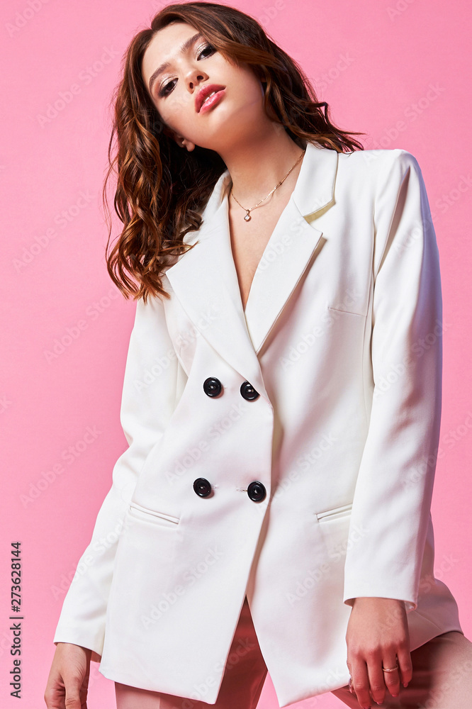 Teen girl, open hand. Professional makeup. Beauty teenage model in the studio. Pink and white background Teen girl, open hand. Professional makeup. Beauty teenage model in the studio. Pink and white background
