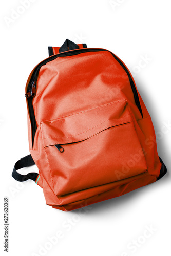 Top view of red school backpack on white background.