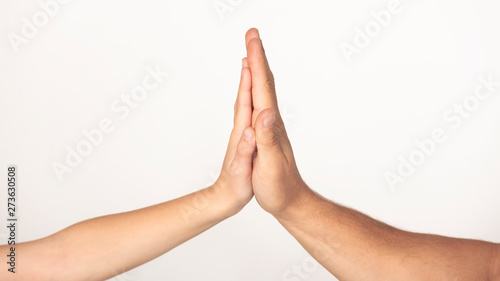 High five gesture of father and child