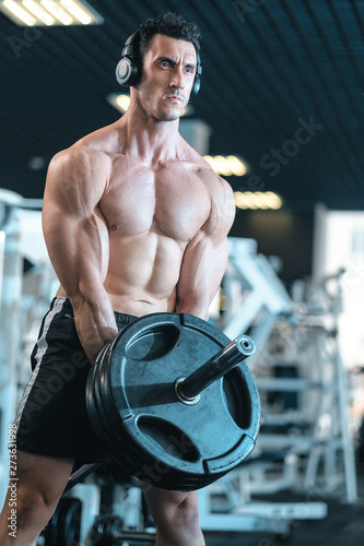 Muscle training athlete, raise the bar. We work hard. Exercises for the back muscles