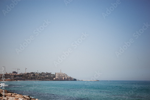 Mediterranean beach with turquoise water in sunny weather