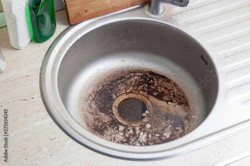 Dirty Sink at kitchen room. Clean a sink drain. unclog a kitchen sink without a disposal photo