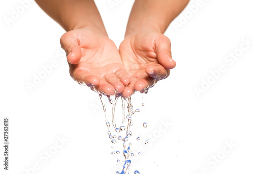 female hands with water flowing out of them on white background