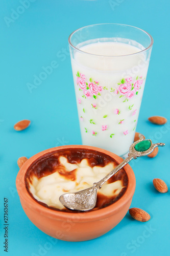 traditional Turkish sweet supangle dish, a glass of airan and almonds photo