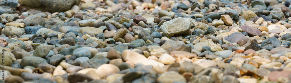 Panoramic view of the dried riverbed. A dry river bed of gravel. Panoramic view of the dried riverbed. A dry river bed of gravel.