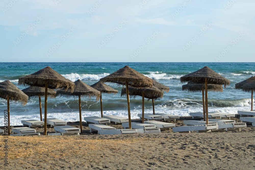 Fototapeta premium Hamacas en la playa del Rincón de la Victoria / Hammocks on the Rincon de la Victoria beach. Rincón de la Victoria. Málaga