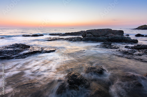 sunrise over the sea coast with rocks © Stefan