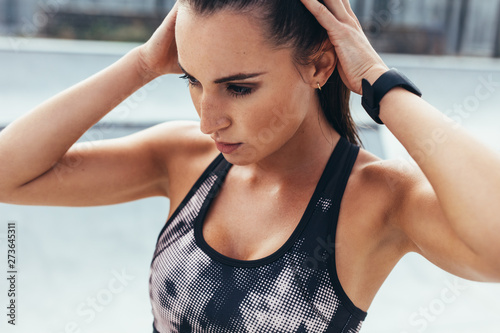 Woman getting ready for training outdoors