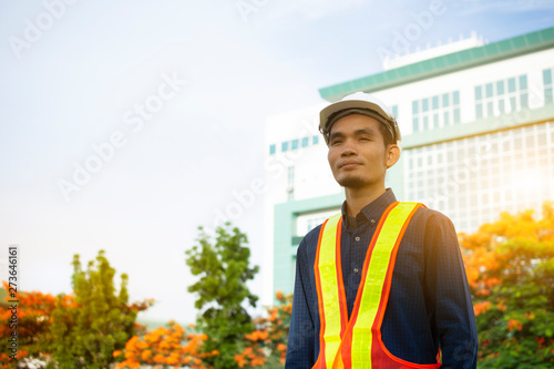 Wallpaper Mural Engineering wears a white safety hat while working. Background building structure Torontodigital.ca