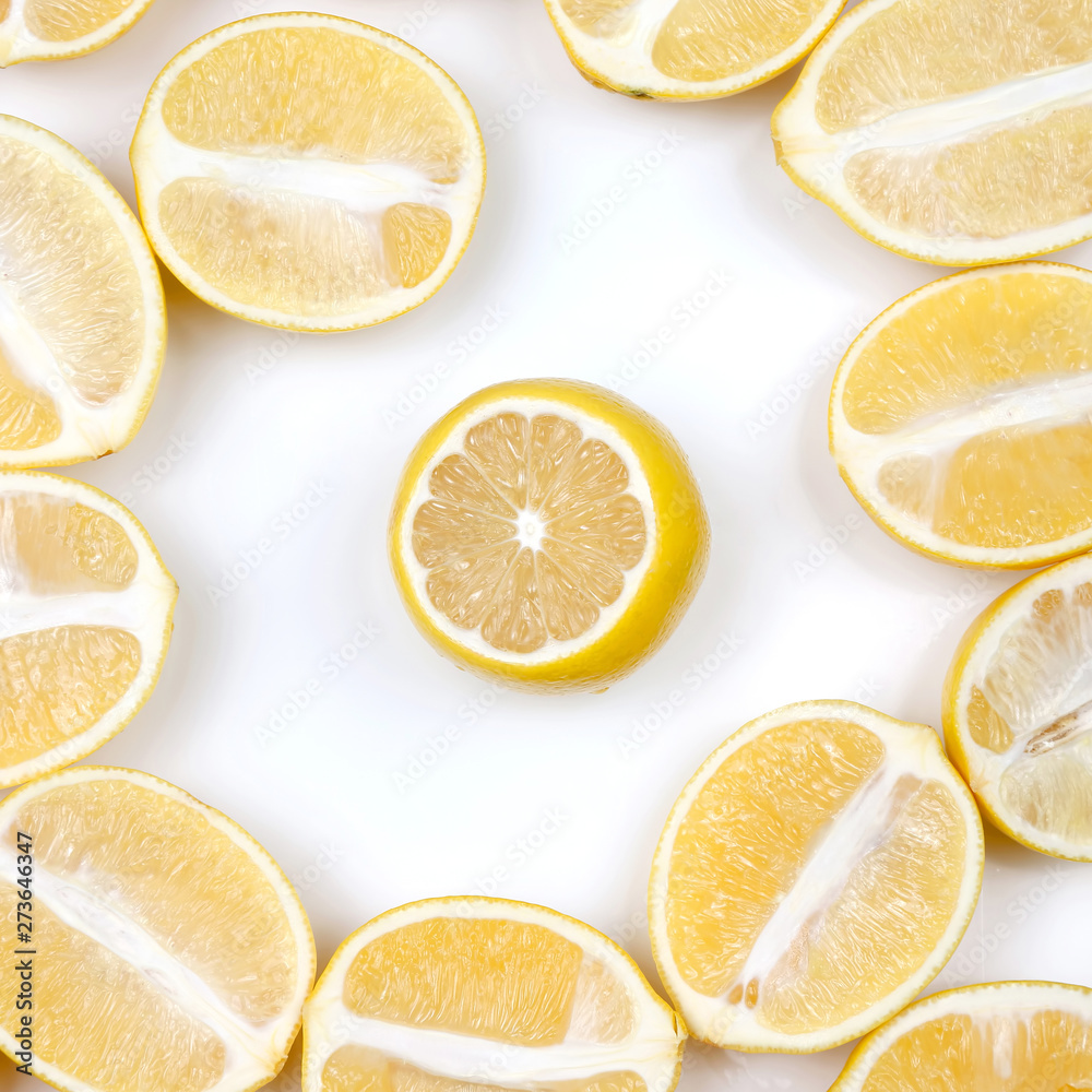 sliced lemons half on a light background.
